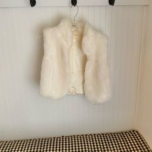 Super cute white fur ladies vest-soft and lined in satin.